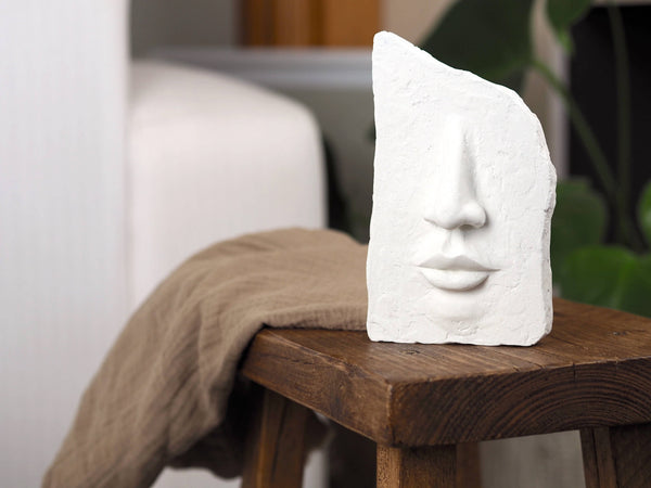 White Concrete Face Sculpture