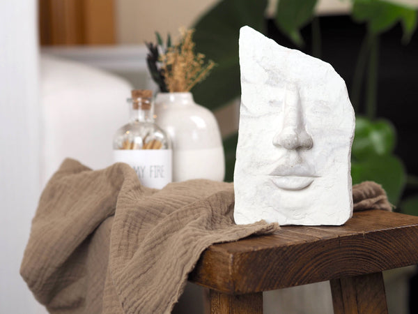 White Concrete Face Sculpture