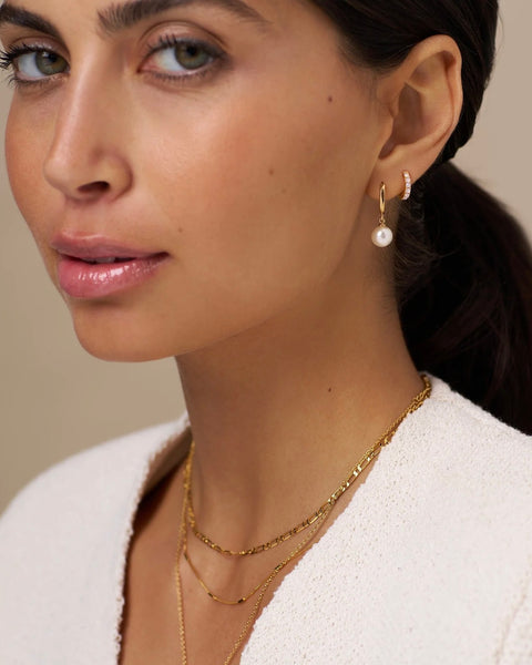 Pearl Drop Huggie Hoop Earrings by Orelia