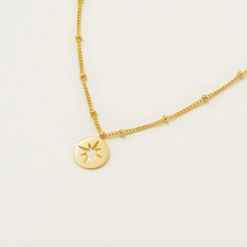 Gold Starburst Disc Necklace by Estella Bartlett