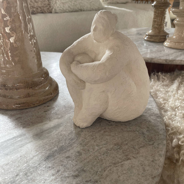 Off White Seated Woman